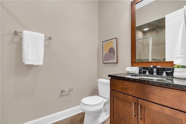 bathroom with large vanity, tile floors, and toilet