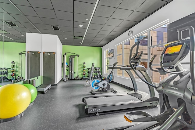 workout area featuring a drop ceiling