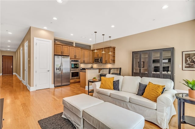 living room with light hardwood / wood-style floors