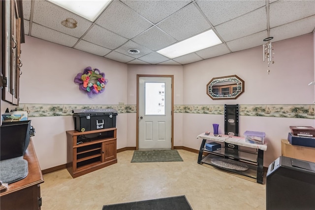 entrance foyer with carpet floors and a paneled ceiling