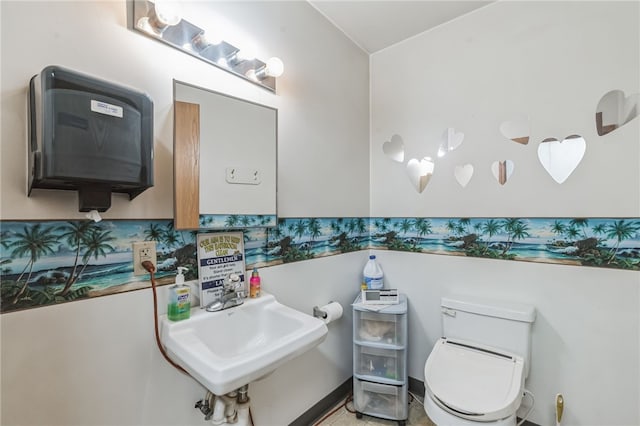 bathroom featuring tile floors, sink, and toilet