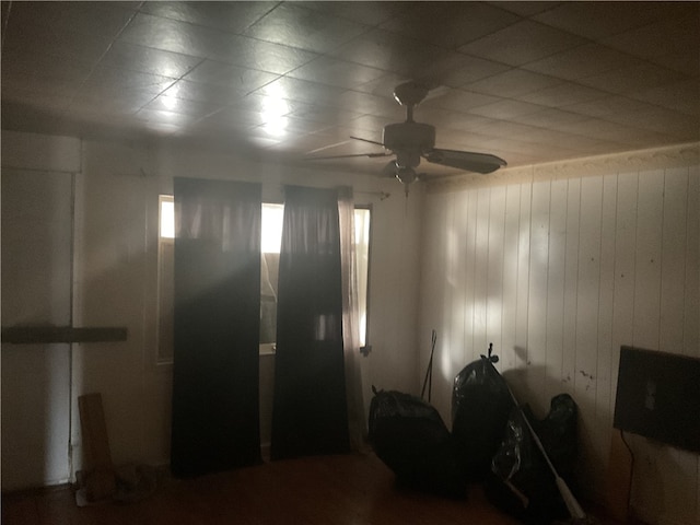 interior space featuring ceiling fan and a paneled ceiling