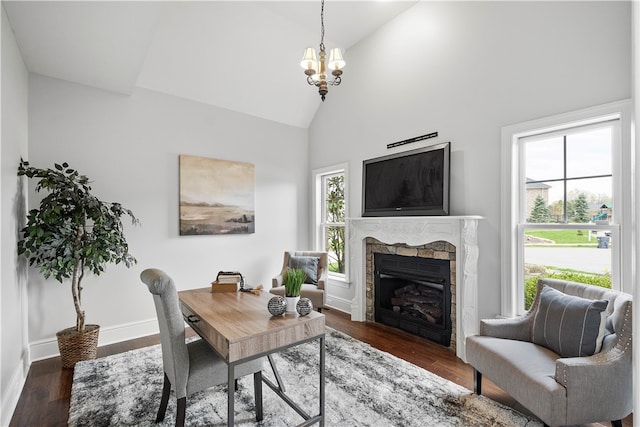 interior space with plenty of natural light, dark wood-type flooring, and a notable chandelier