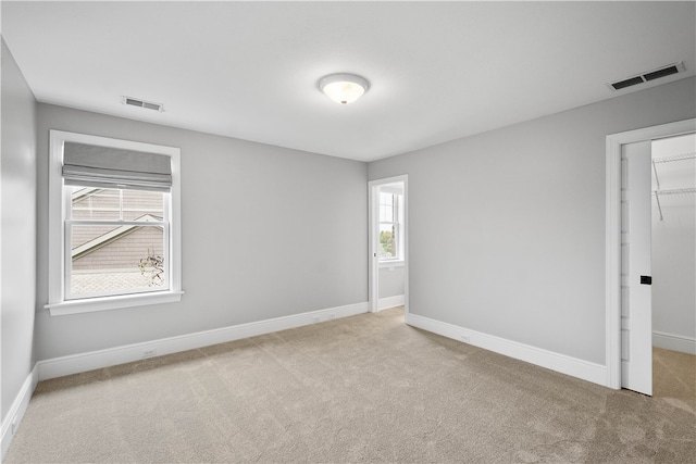 empty room with light colored carpet