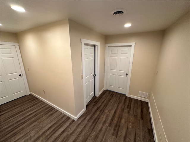 hallway featuring dark wood-type flooring