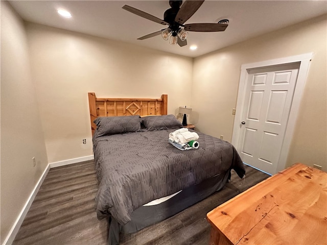 bedroom featuring ceiling fan and dark hardwood / wood-style floors