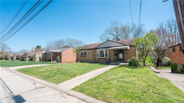 ranch-style house with a front lawn