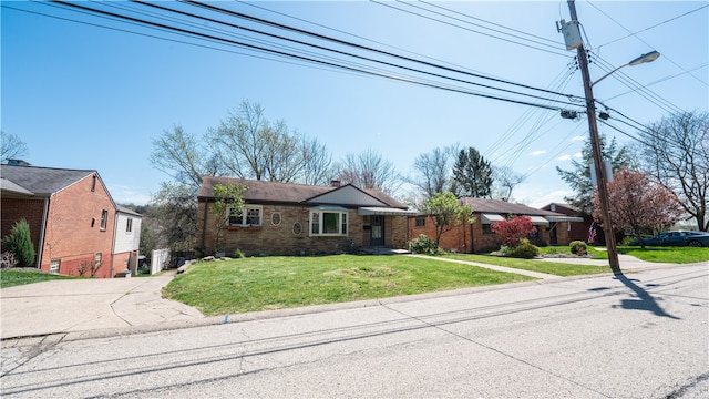 ranch-style house with a front yard