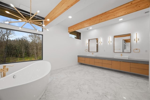 bathroom with tile patterned flooring, a washtub, a chandelier, beamed ceiling, and dual vanity