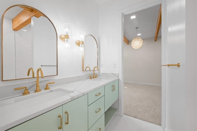 bathroom featuring beamed ceiling and double vanity