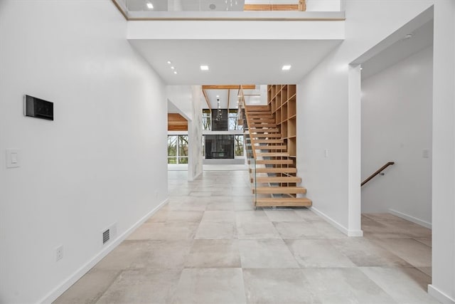 hallway with light tile patterned floors