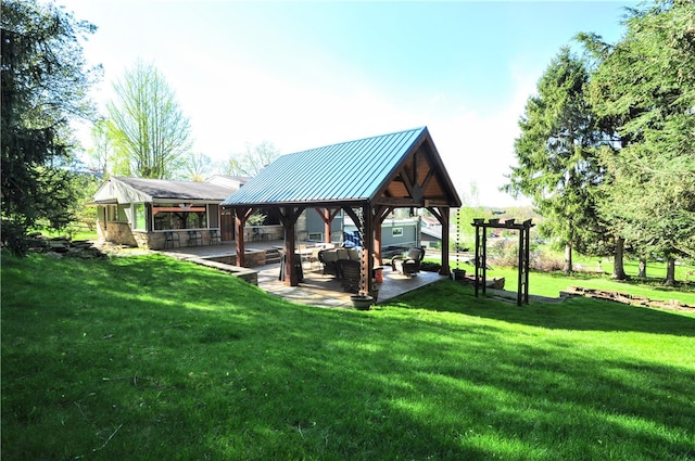 surrounding community featuring a gazebo and a yard