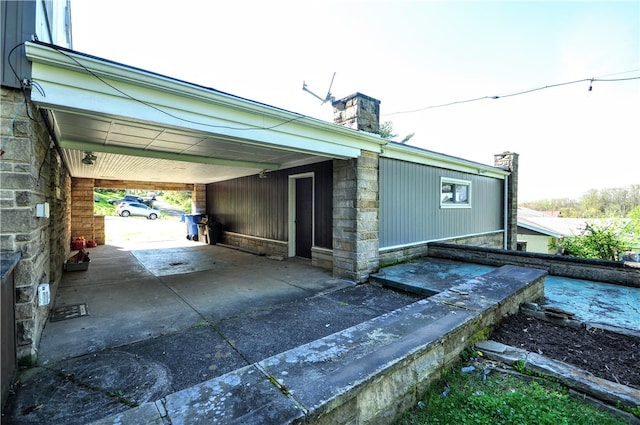 view of property exterior featuring a carport