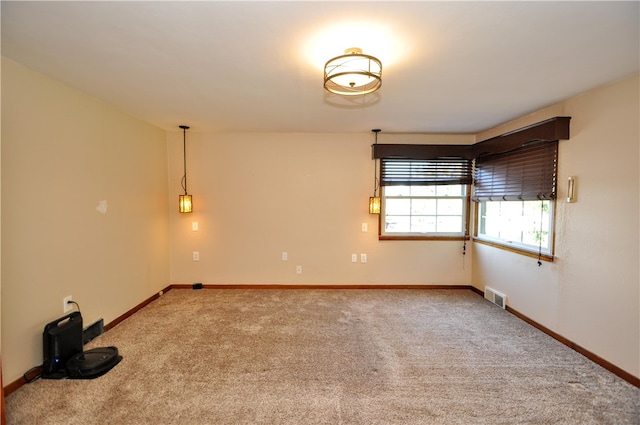 spare room with light colored carpet