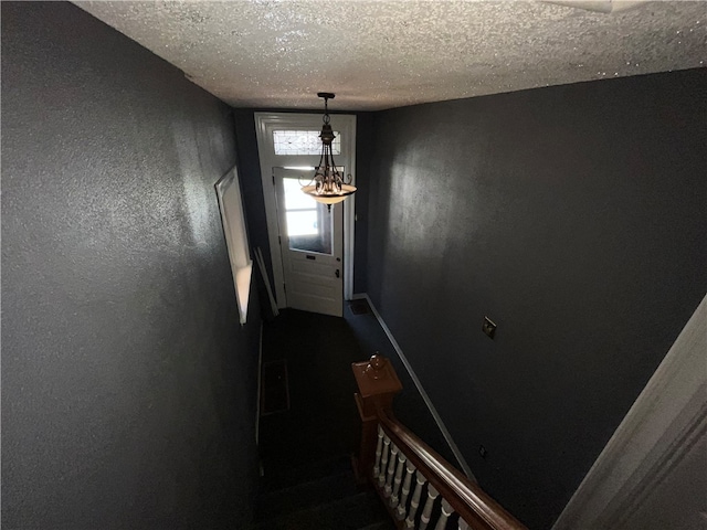 interior space featuring a textured ceiling