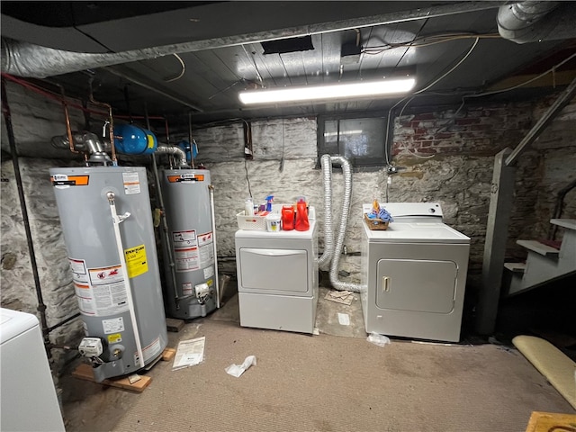 basement featuring water heater and separate washer and dryer