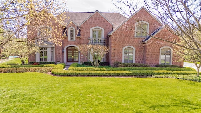 tudor house featuring a front yard