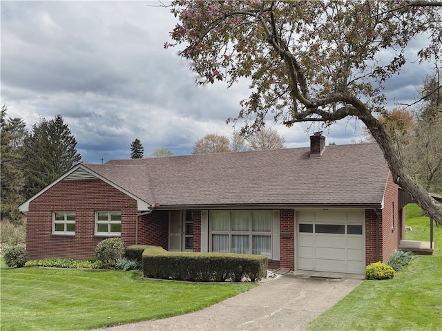 ranch-style home featuring a garage and a front yard