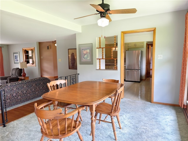 dining room with wood-type flooring and ceiling fan