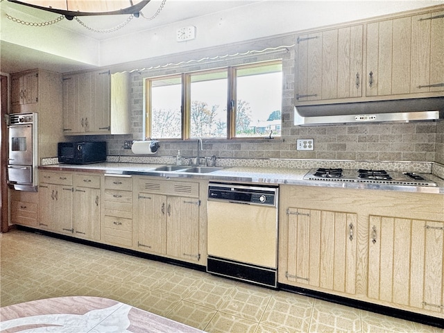 kitchen with tasteful backsplash, stainless steel appliances, light tile floors, and ventilation hood