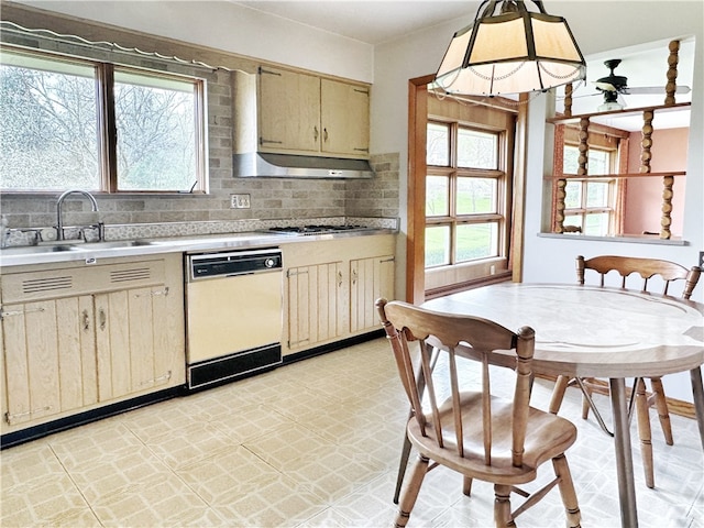 kitchen with backsplash, sink, light tile flooring, and dishwasher