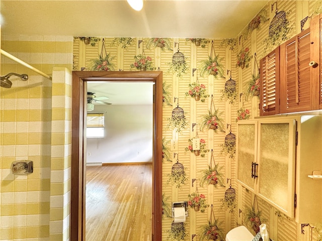 bathroom featuring wood-type flooring and ceiling fan