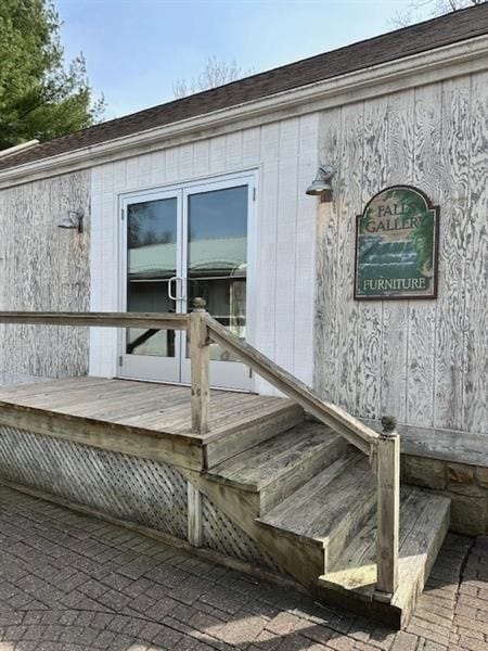 doorway to property with a deck