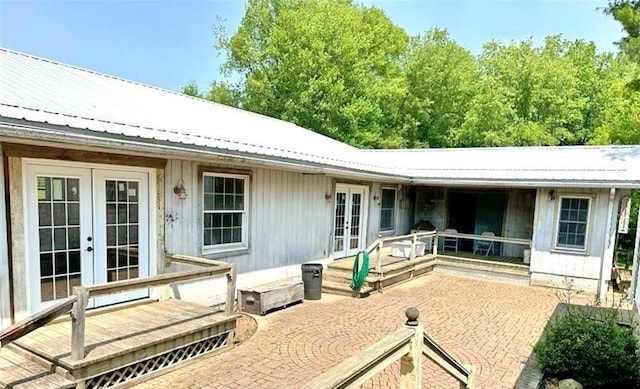 rear view of property featuring french doors