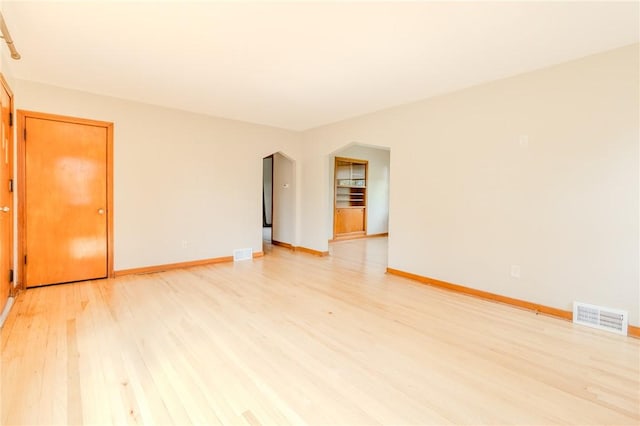 unfurnished room featuring light hardwood / wood-style floors