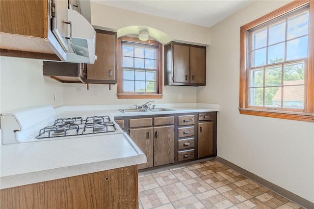 kitchen featuring stove and sink