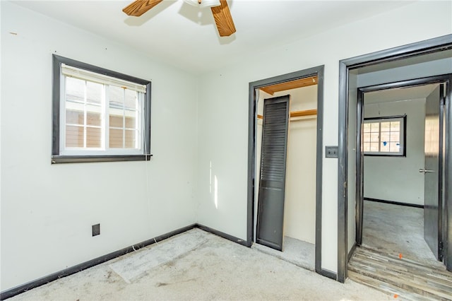 unfurnished bedroom featuring carpet, a closet, and ceiling fan