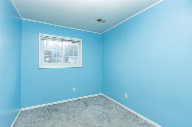 spare room with carpet flooring and crown molding