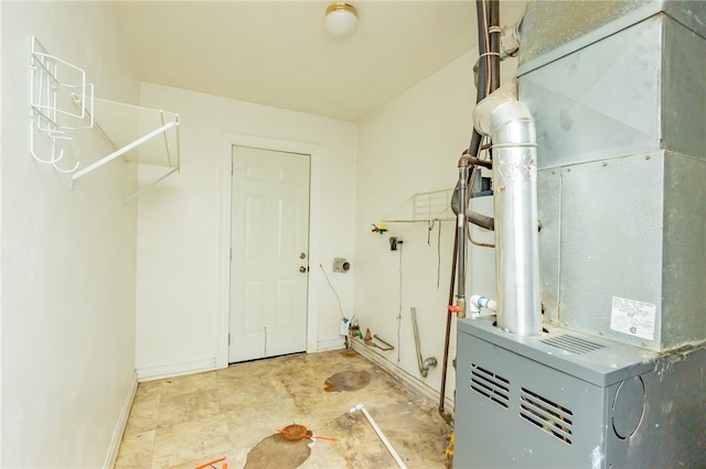 utility room featuring heating utilities