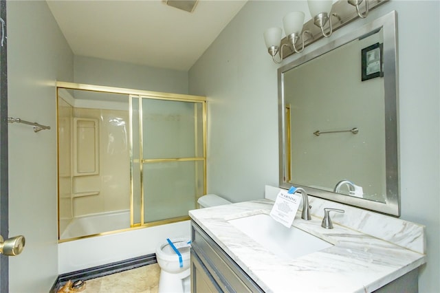 full bathroom featuring shower / bath combination with glass door, vanity, toilet, and tile flooring