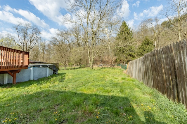 view of yard featuring a wooden deck