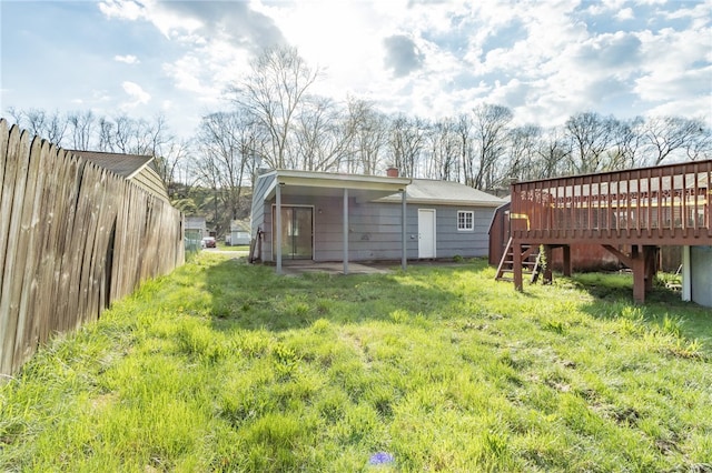 view of yard featuring a wooden deck