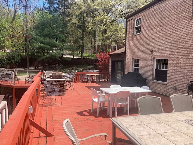 wooden deck featuring area for grilling