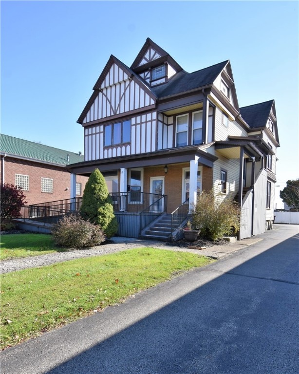 view of front facade with a garage and a porch