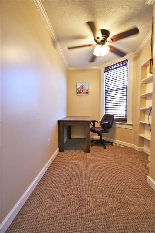 unfurnished office with crown molding, carpet, ceiling fan, and a textured ceiling