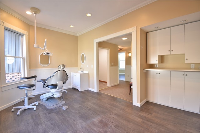 exercise area with ornamental molding and dark hardwood / wood-style flooring