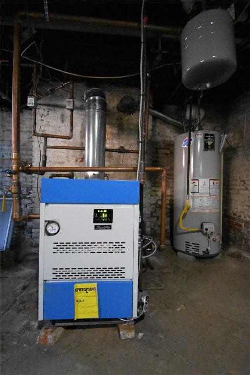 utility room with gas water heater