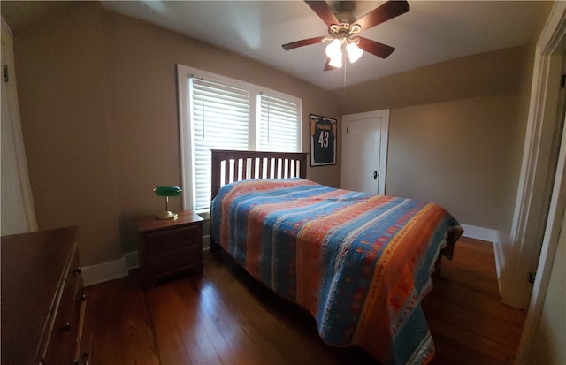 bedroom with dark wood-type flooring and ceiling fan