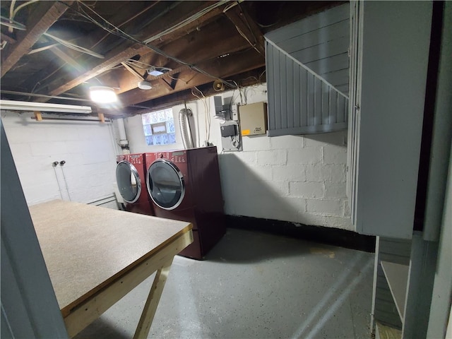 clothes washing area featuring washer and dryer