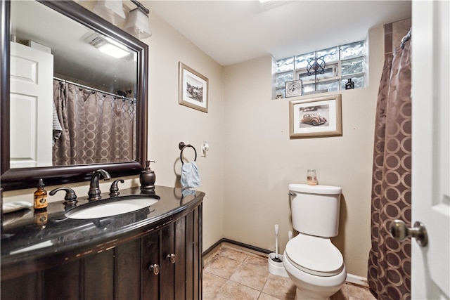 bathroom with tile patterned floors, vanity, and toilet