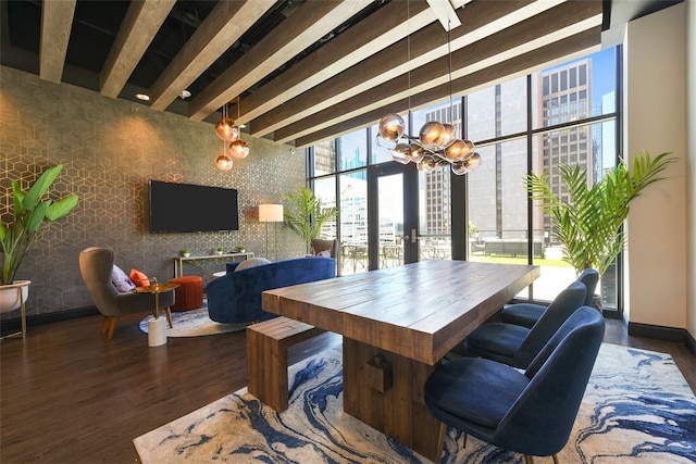 dining area featuring dark hardwood / wood-style floors, beam ceiling, and a notable chandelier