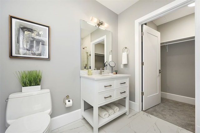 bathroom with vanity, tile floors, and toilet