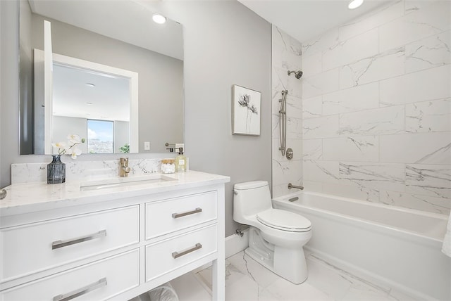 full bathroom with tile floors, tiled shower / bath, toilet, and large vanity