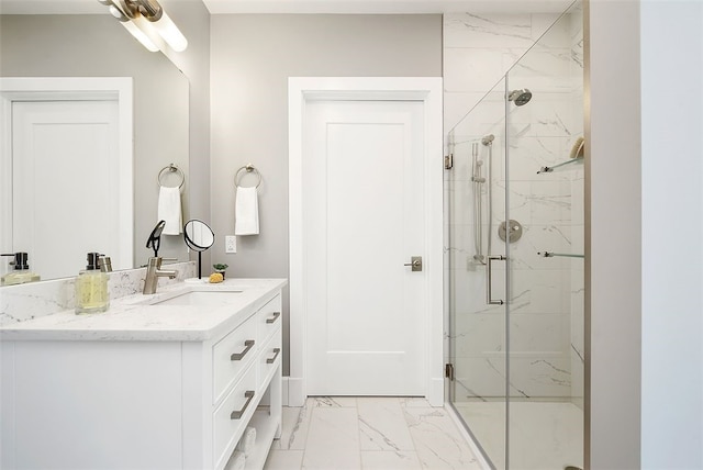 bathroom featuring a shower with shower door, vanity, and tile flooring