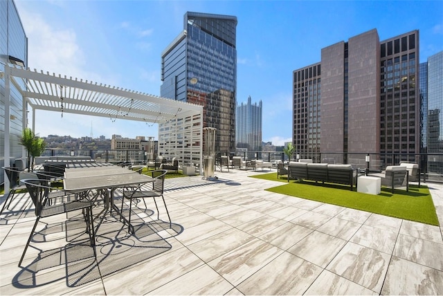 view of patio featuring outdoor lounge area and a pergola