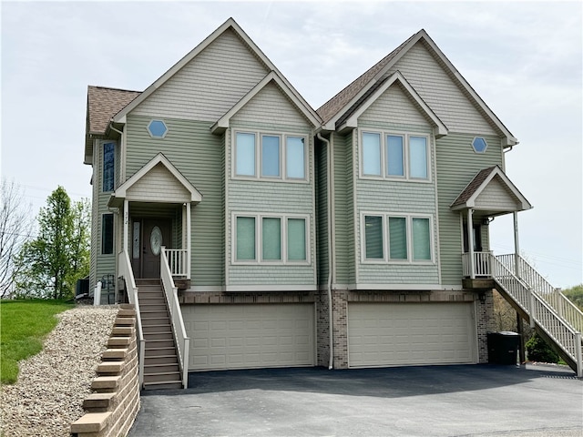 view of front of house featuring a garage and covered porch